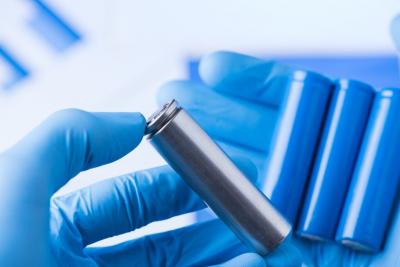 Ion batteries in gloved hands