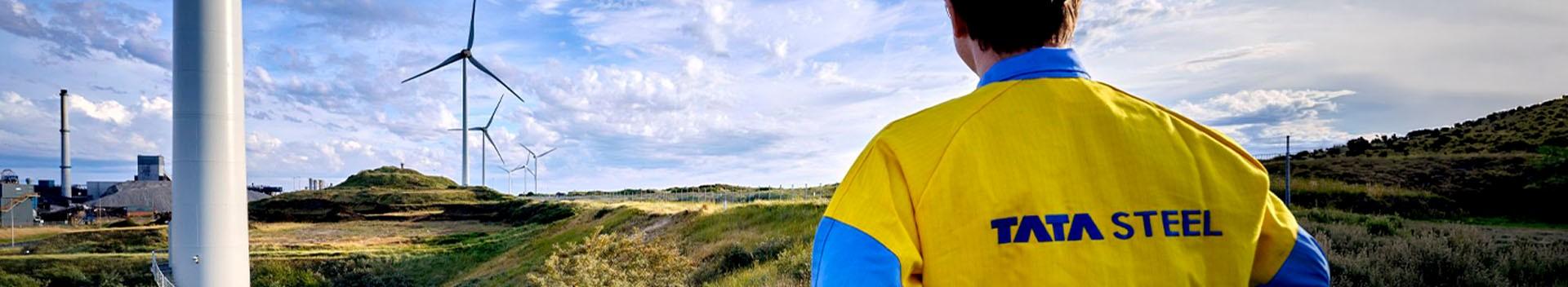 Tata Steel employee looking at windmills in nature