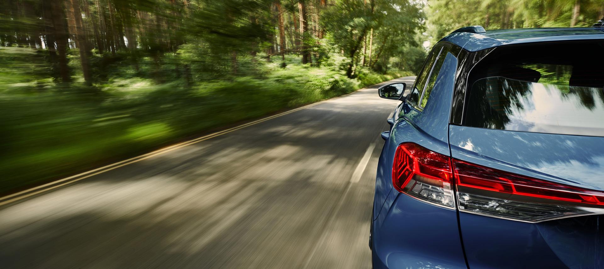 Automotive moving blue car