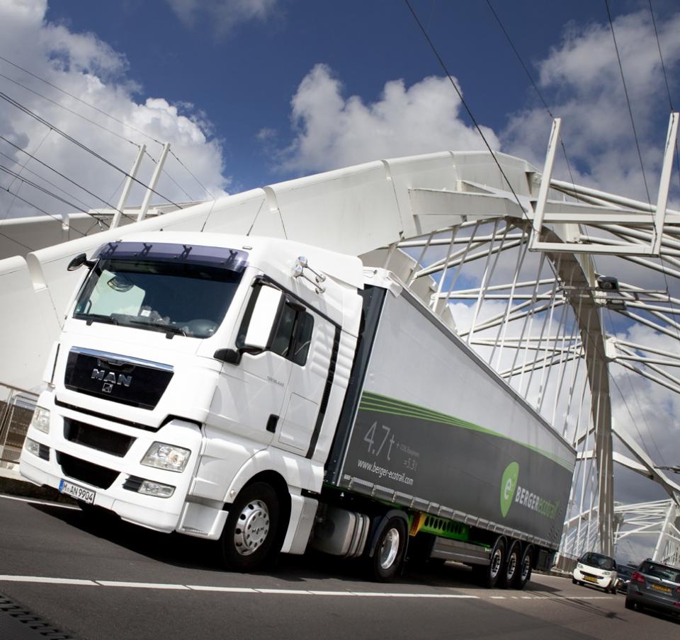 White BERGERecotrail truck in transit through white bridge White BERGERecotrail truck in transit through white bridge