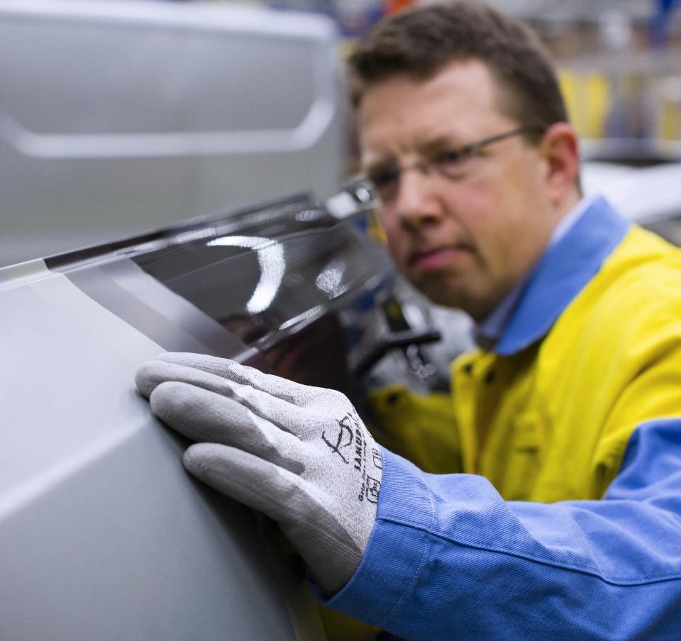 Tata Steel operative inspecting an outer panel
