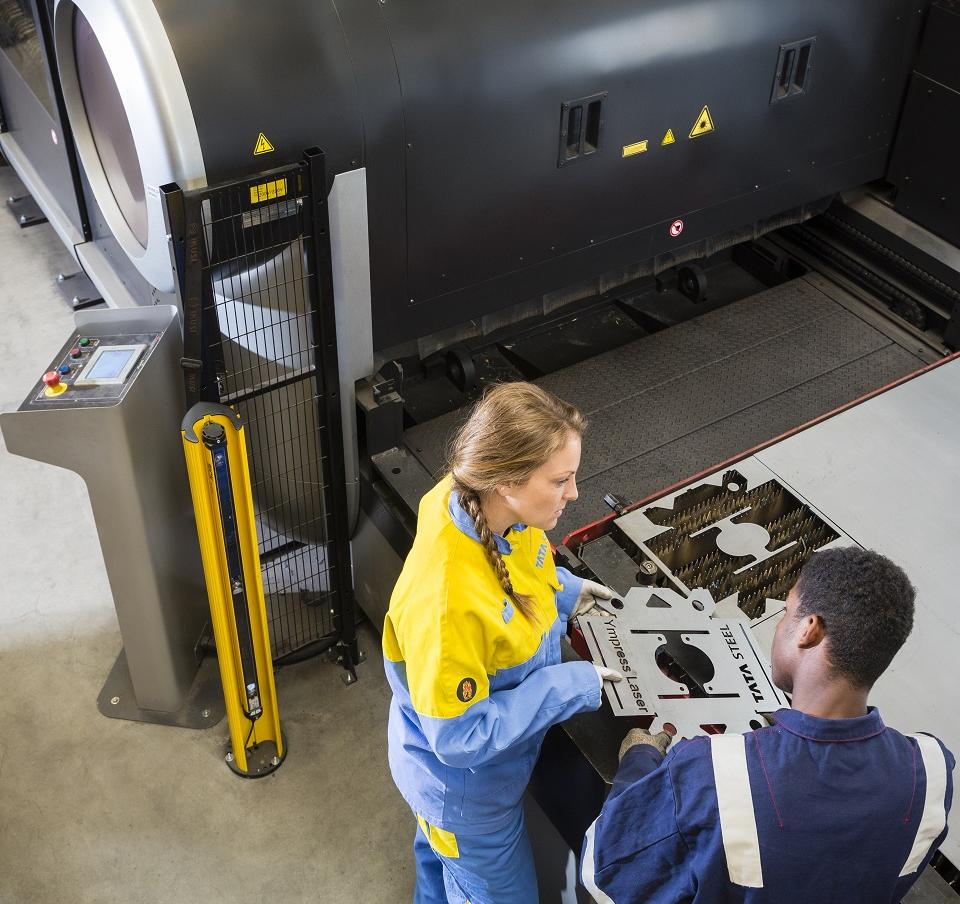 Metal workers looking at the quality and excellent surface provided by Ympress Laser Metal workers looking at the quality and excellent surface provided by Ympress Laser