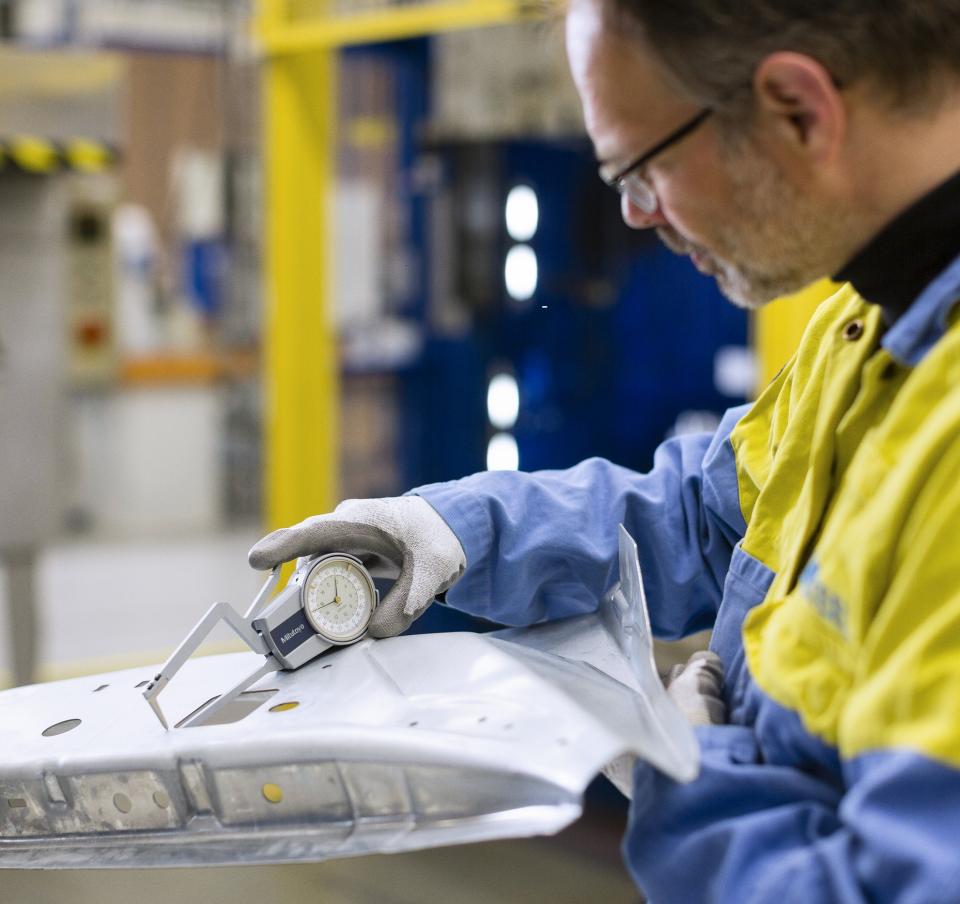 Quality testing on a panel being carried out by a technician Quality testing on a panel being carried out by a technician