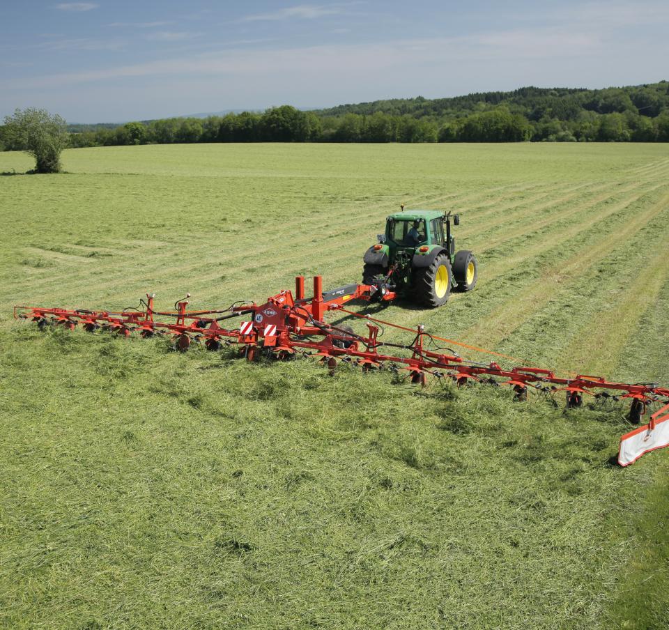 Agricultural machinery in a field Agricultural machinery in a field