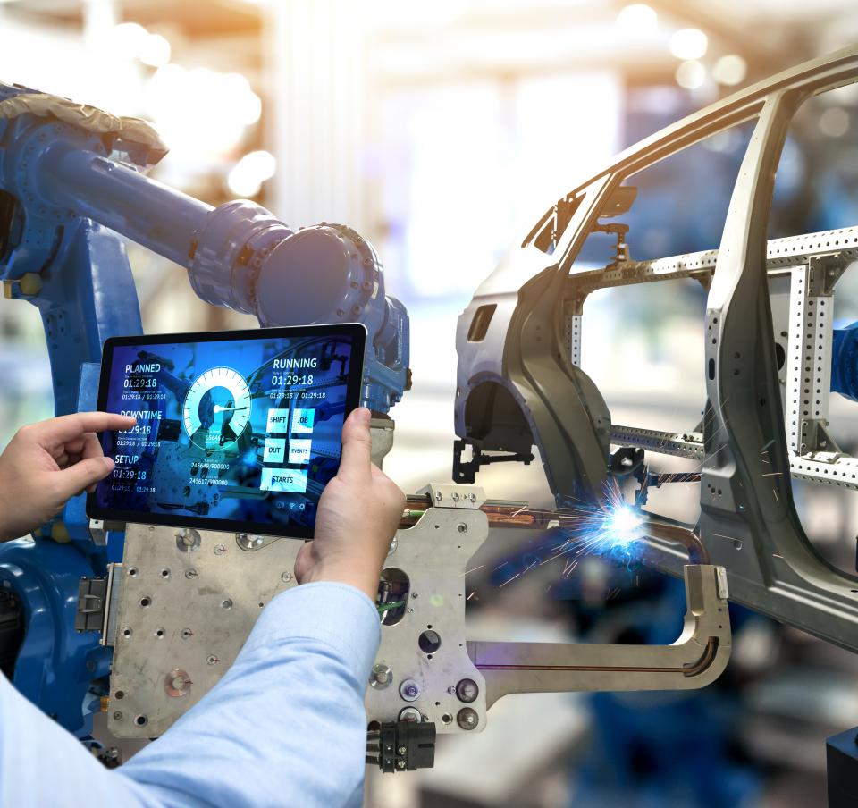 Man using technology at a smart factory Man using technology at a smart factory