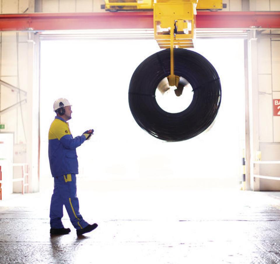 Tata Steel worker using a hand held remote device to move a coil at Dudley service centre Tata Steel worker using a hand held remote device to move a coil at Dudley service centre