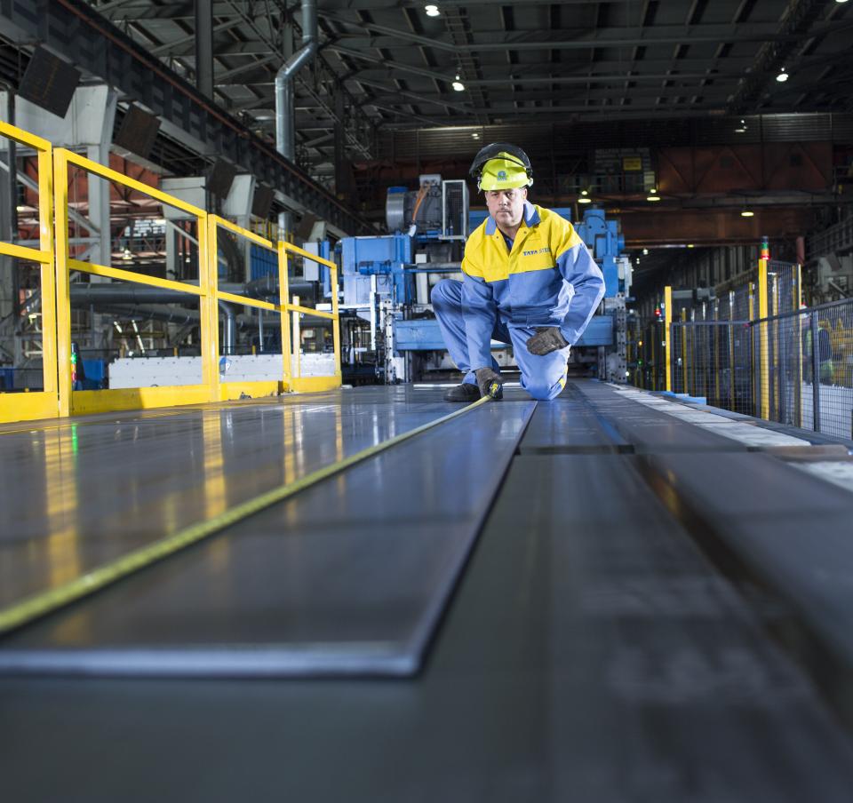 Tata Steel operative using a decoil machine