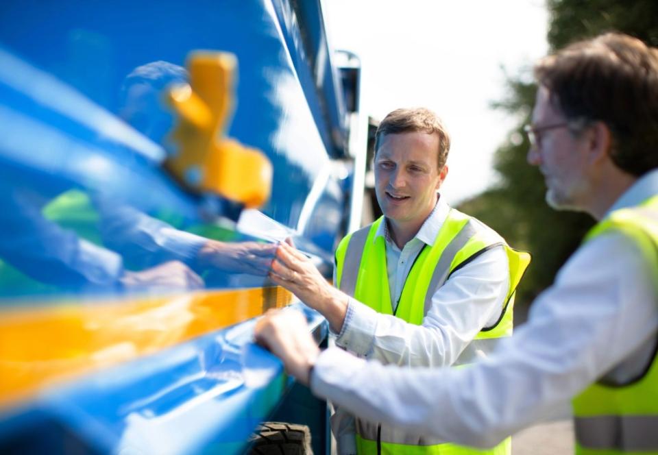 Two men checking the high steel quality of a truck